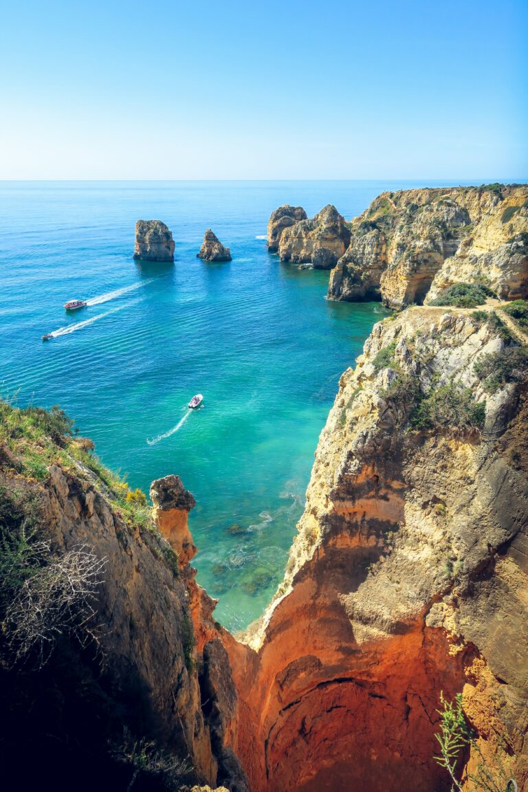 A beautiful view of Porto in summer with boats and a beach