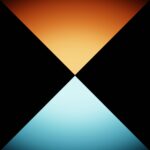 Two triangles touching points are seen in orange and yellow for an artistic design