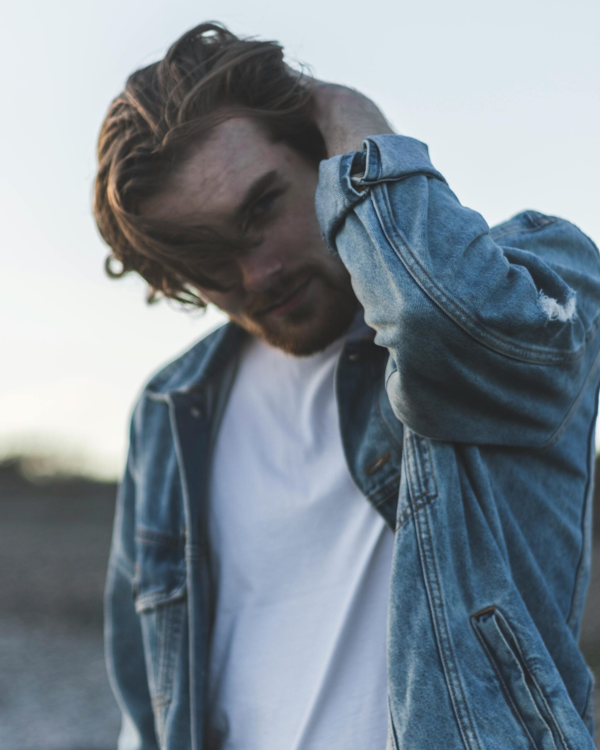 A male model wears a denim jacket and white T shirt